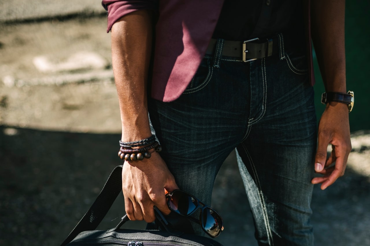 A stylish man wearing a leather banded watch