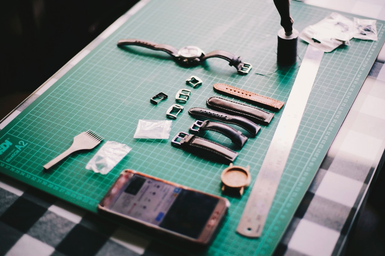 A view of a craftsman’s work desk as they prepare to service a wristwatch.